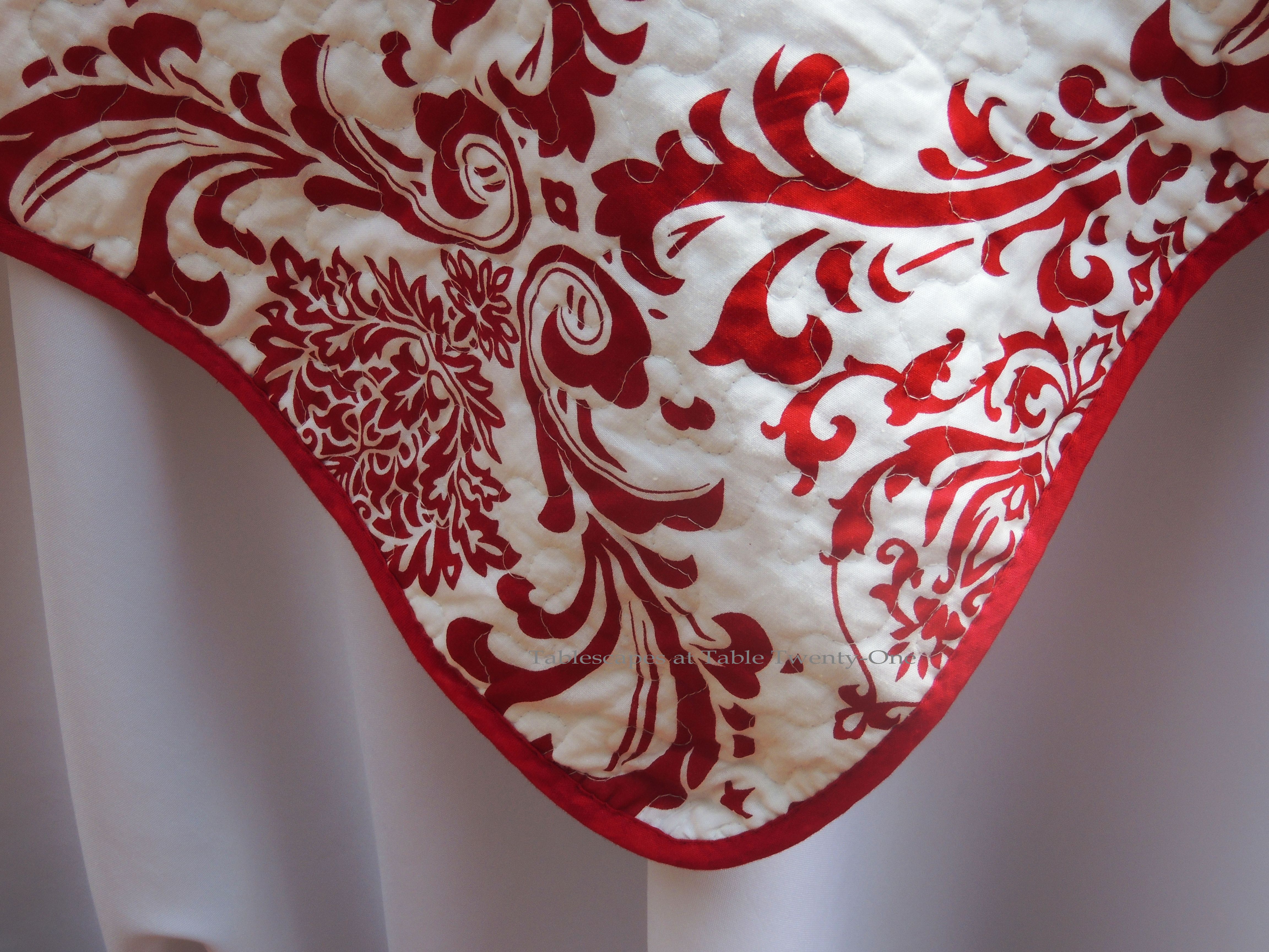 INSPIRATION: The red & white damask side of a reversible quilted throw from Tuesday Morning.